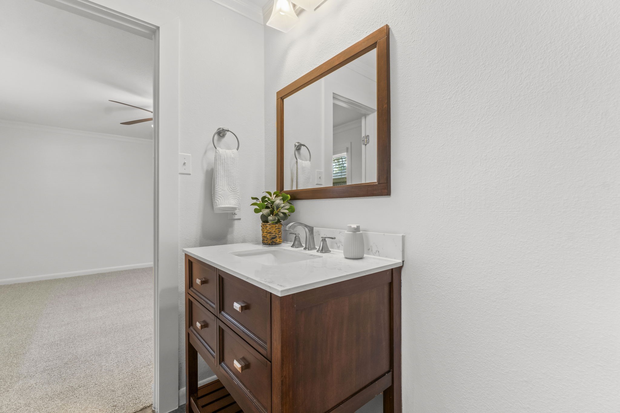 3223 Kentwood Drive Spring, TX 77380 - Photo 20 of 31 This en-suite bath has it all, offering a stylish vanity, framed mirror, and neutral tone finishes.