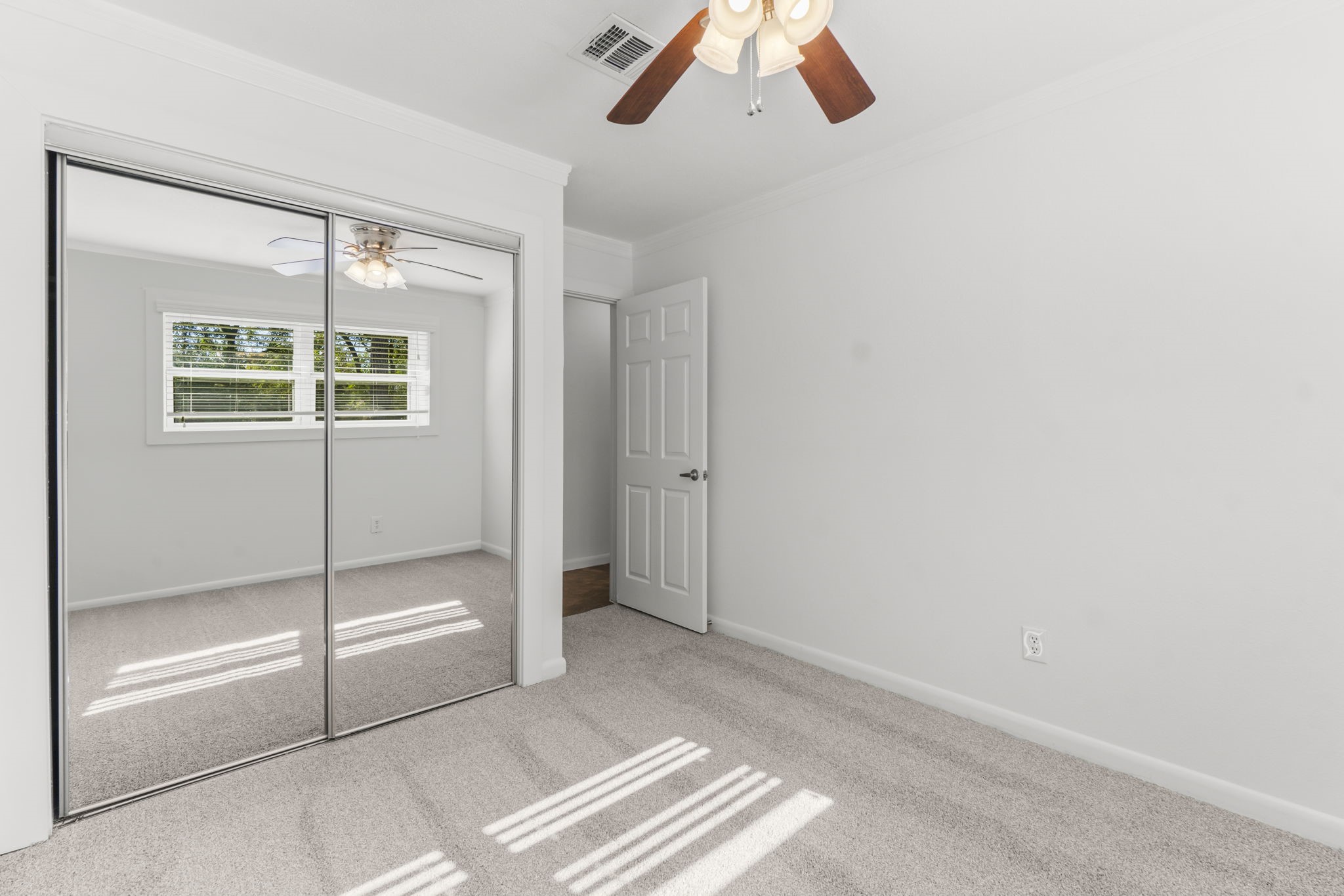 3223 Kentwood Drive Spring, TX 77380 - Photo 23 of 31 Bedroom featuring mirrored closet doors and abundant natural lighting, providing an open, airy feel.