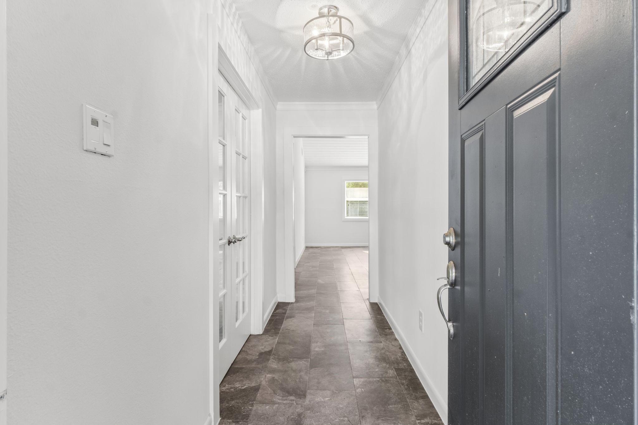 3223 Kentwood Drive Spring, TX 77380 - Photo 4 of 31 Bright entry hallway featuring fresh neutral paint, tile flooring, and a sight line toward the main living areas.