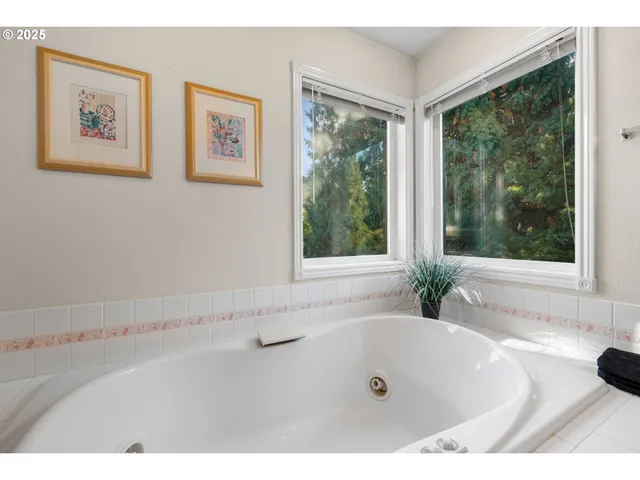 a bath tub sitting next to a window