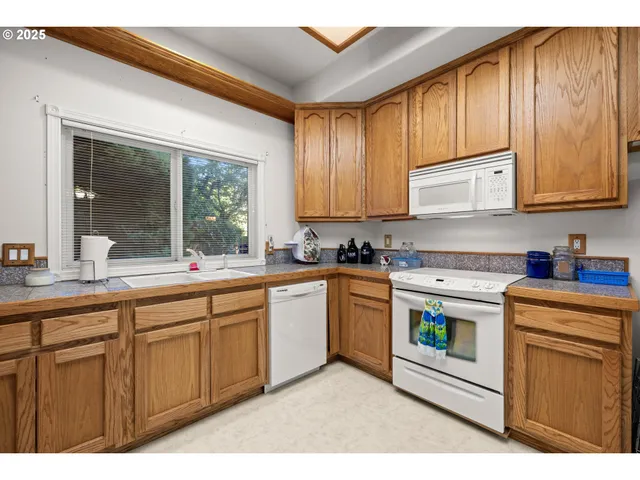 a kitchen with sink cabinets and window