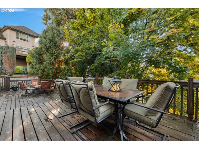 a view of a chairs and table on the deck