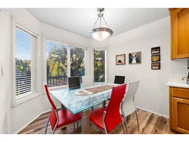 a view of a dining room with furniture window and wooden floor