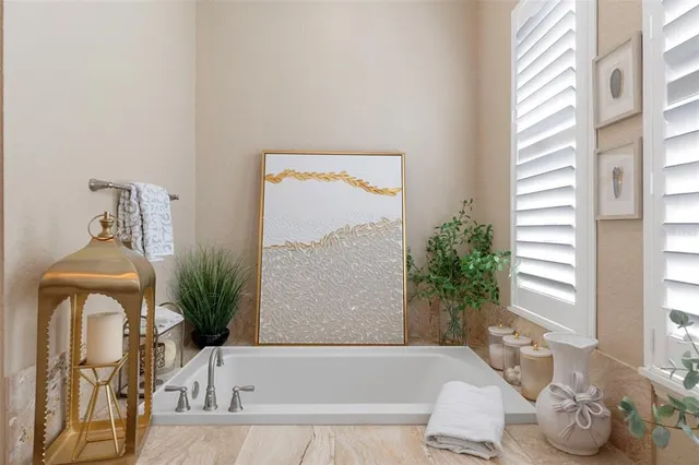 a bath tub sitting next to a window