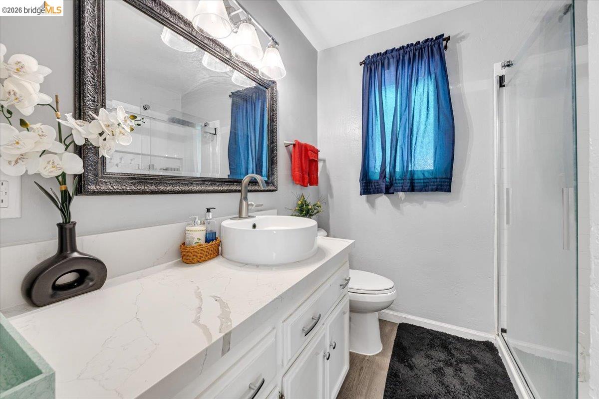 8733 Fraguero Road Sonora, CA 95370 - Photo 49 of 73 Bathroom vanity featuring a vessel sink, single-hole faucet, and a quartz countertop