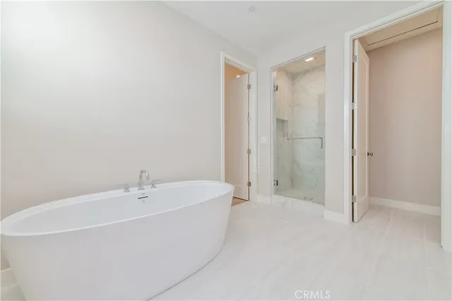 a white bath tub sitting in a bathroom