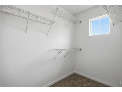 a view of a room with racks on the wall