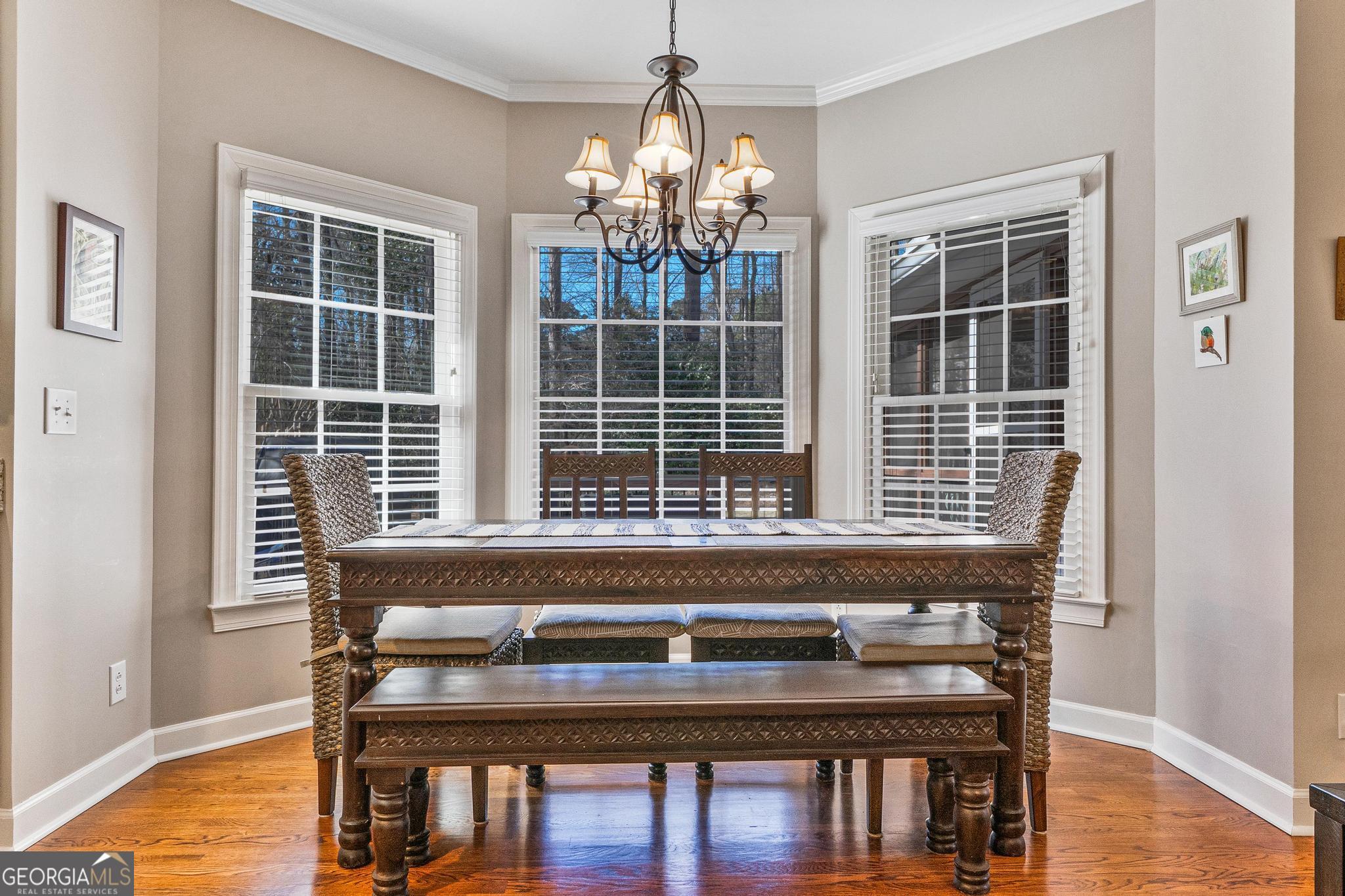 204 Carriage Way Macon, GA 31210 - Photo 11 of 28 a kitchen table a chair and wooden floor