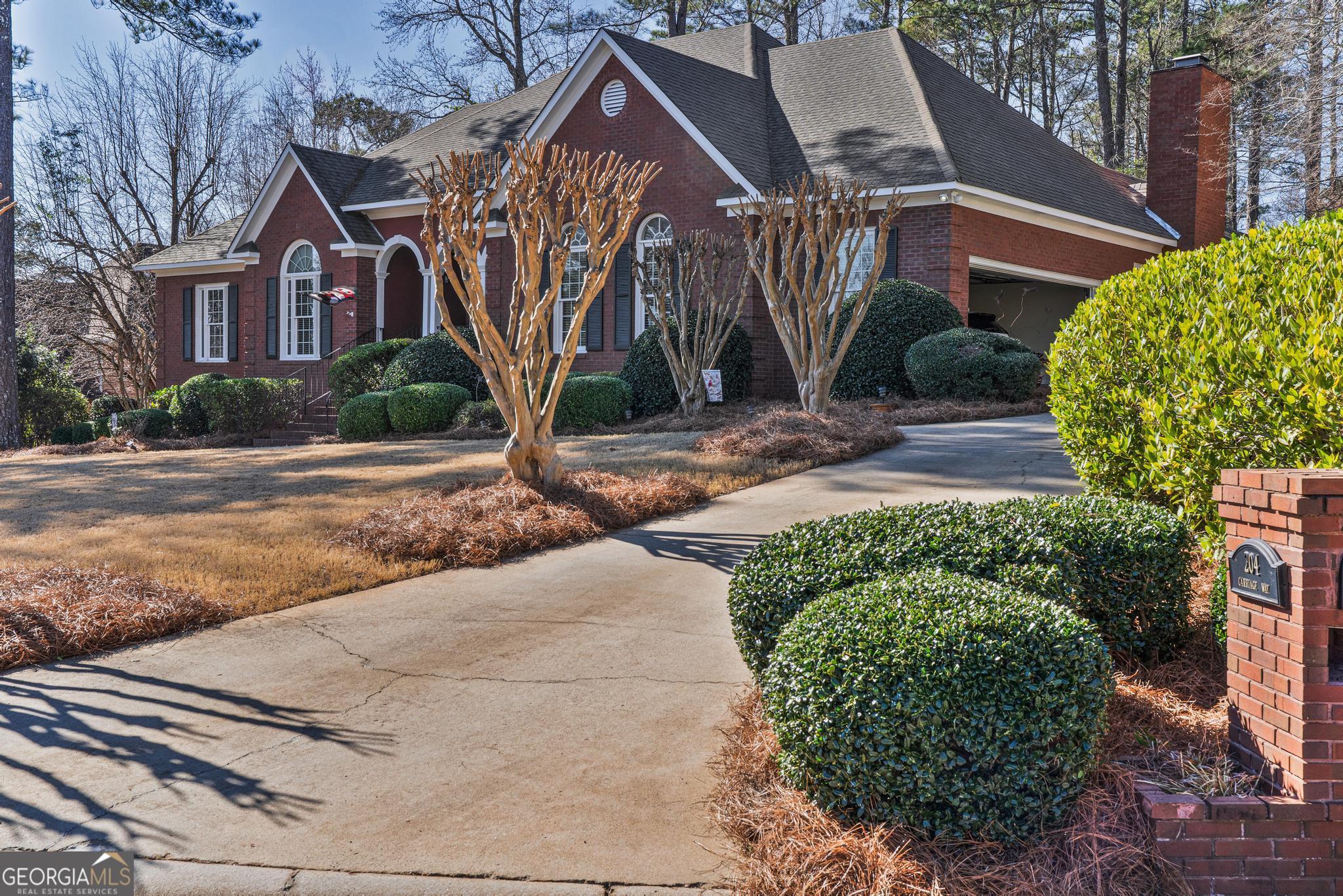 204 Carriage Way Macon, GA 31210 - Photo 2 of 28 a front view of a house with a yard