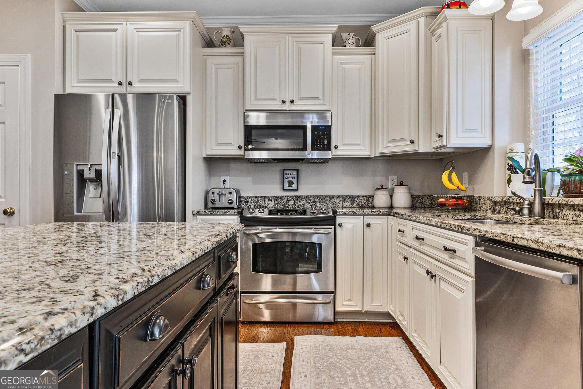 204 Carriage Way Macon, GA 31210 - Photo 8 of 28 a kitchen with stainless steel appliances granite countertop a refrigerator sink and stove