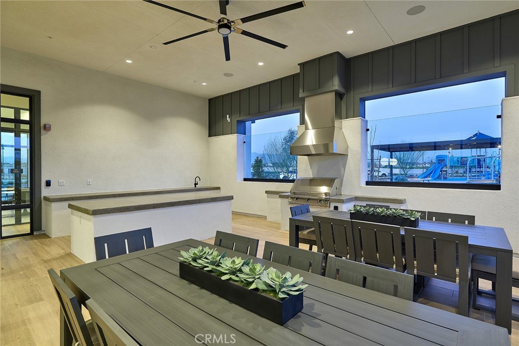6059 Burren Way Eastvale, CA 92880 - Photo 15 of 30 a kitchen with a table and chairs in it