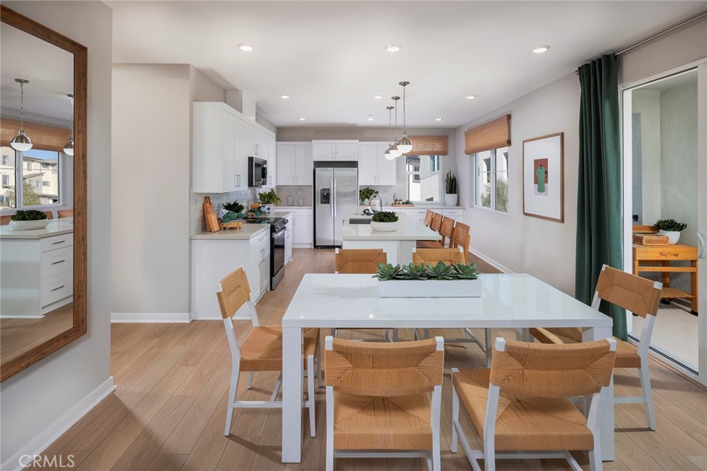6059 Burren Way Eastvale, CA 92880 - Photo 2 of 30 a dining room with furniture and window