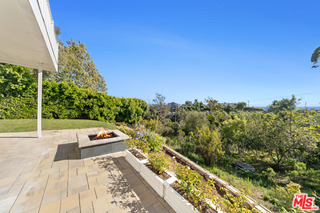 5958 Busch Drive Malibu, CA 90265 - Photo 17 of 39 a view of a balcony with chair and wooden floor