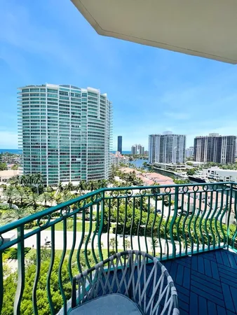 a view of swimming pool with outdoor seating and city view