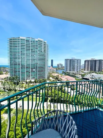 a view of swimming pool with outdoor seating and city view