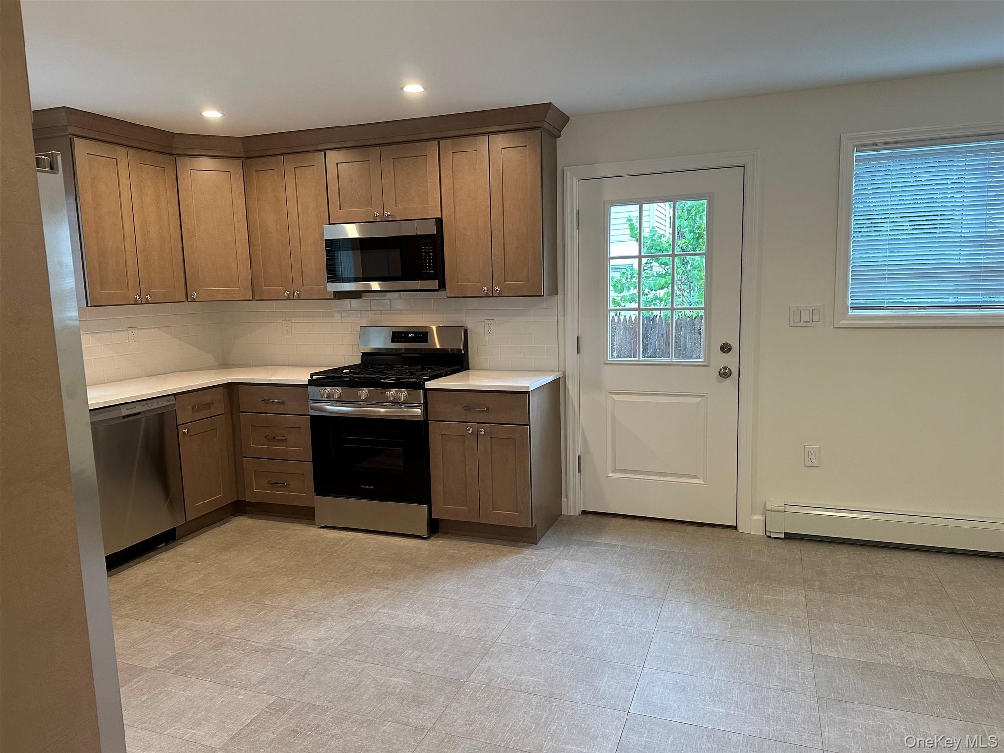 32 Marwood Road South, Unit A Port Washington, NY 11050 - Photo 3 of 14 Door to Patio and Backyard
