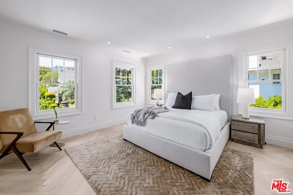 a bedroom with a bed and a couch