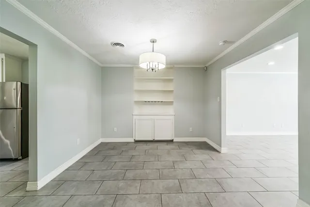 a view of an empty room with a fireplace