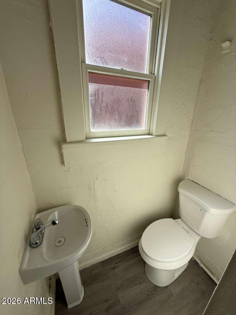 663 East 8th Street Douglas, AZ 85607 - Photo 11 of 11 a white toilet sitting next to a bathroom sink
