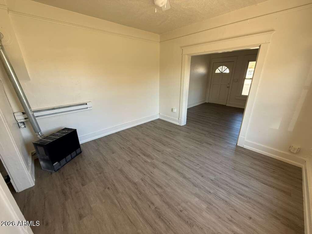 663 East 8th Street Douglas, AZ 85607 - Photo 5 of 11 wooden floor in an empty room