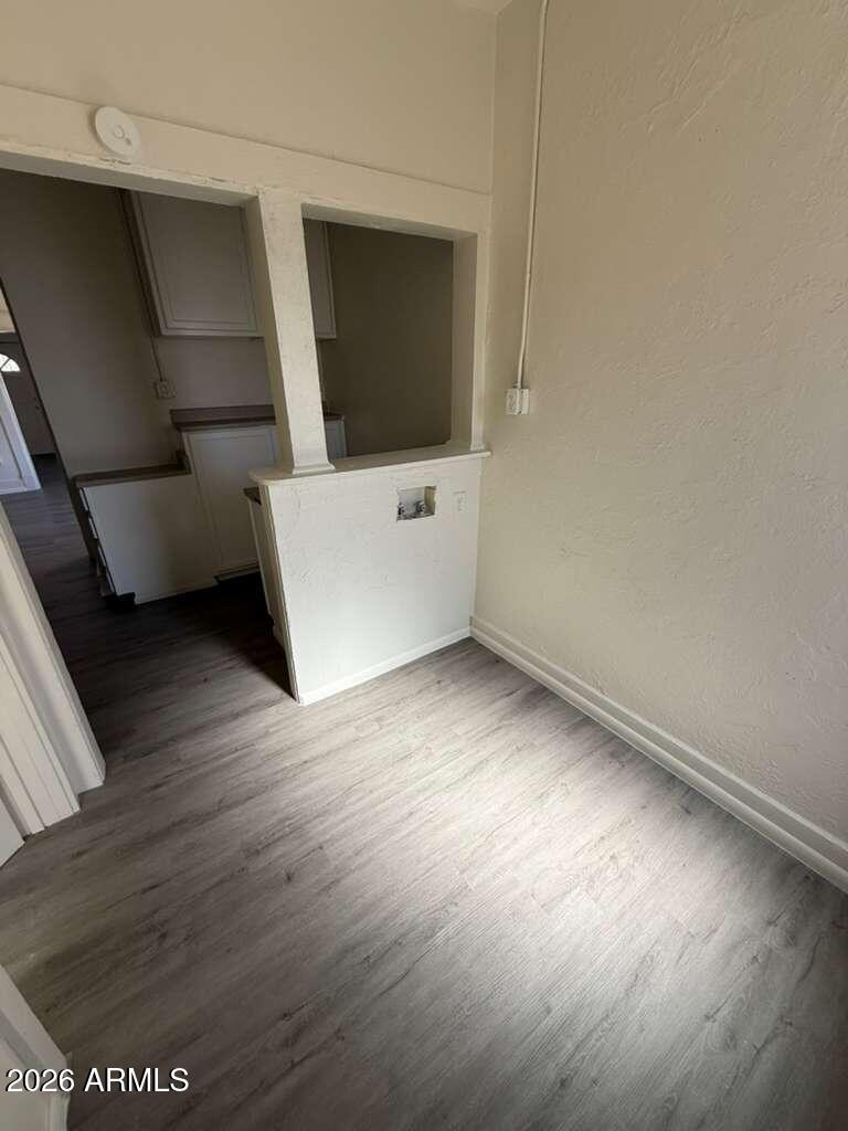 663 East 8th Street Douglas, AZ 85607 - Photo 9 of 11 a view of a livingroom with wooden floor and flat screen tv