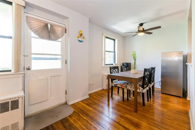a view of a dining room with furniture and window