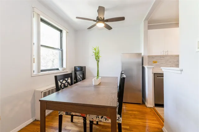 a view of a dining room with furniture and a window