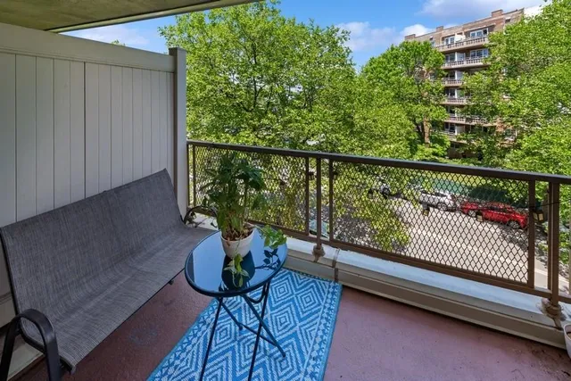 a view of balcony with furniture