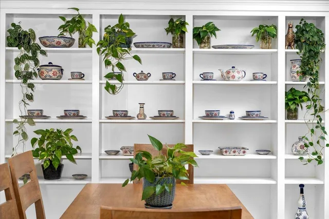 a living room with furniture and next to a window