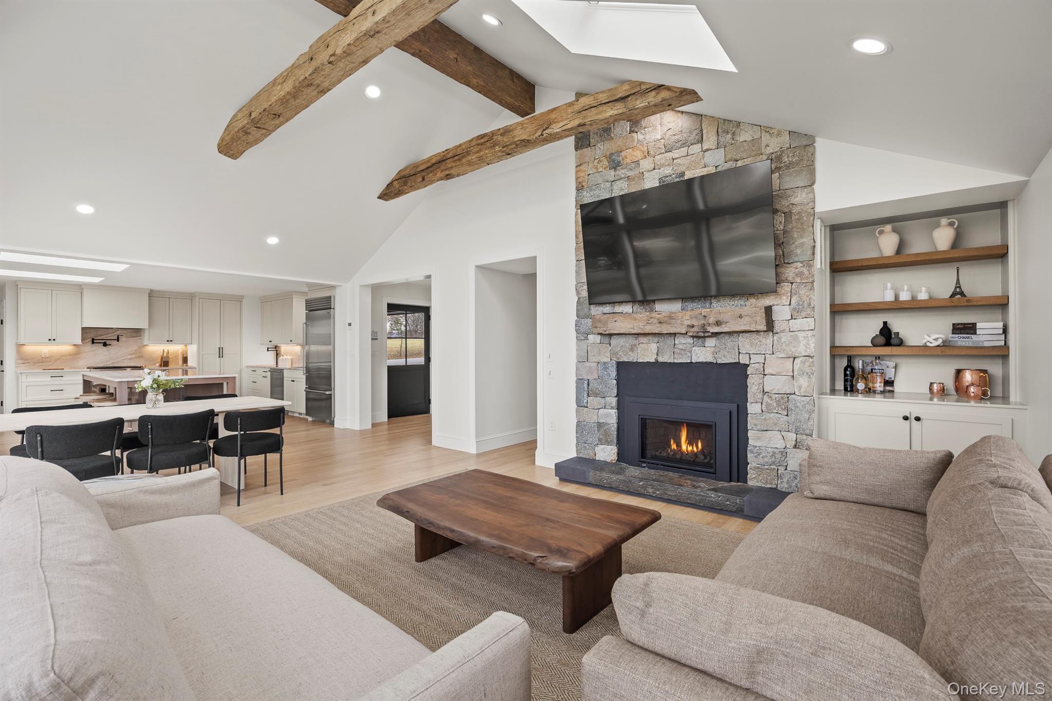 97 Valley Farm Road Millbrook, NY 12545 - Photo 16 of 50 Living area featuring a gas fireplace and beamed ceiling