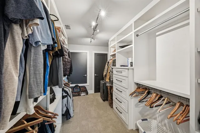 a view of a patio with dining table and chairs