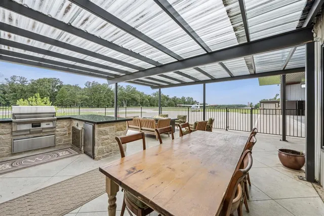 a roof deck with a table and chairs