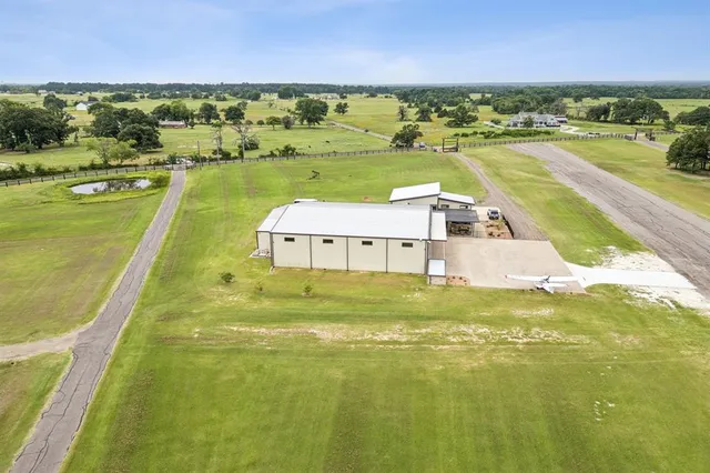 a house with swimming pool in front of it