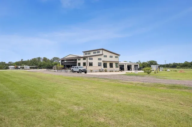 a front view of a house with a ocean view