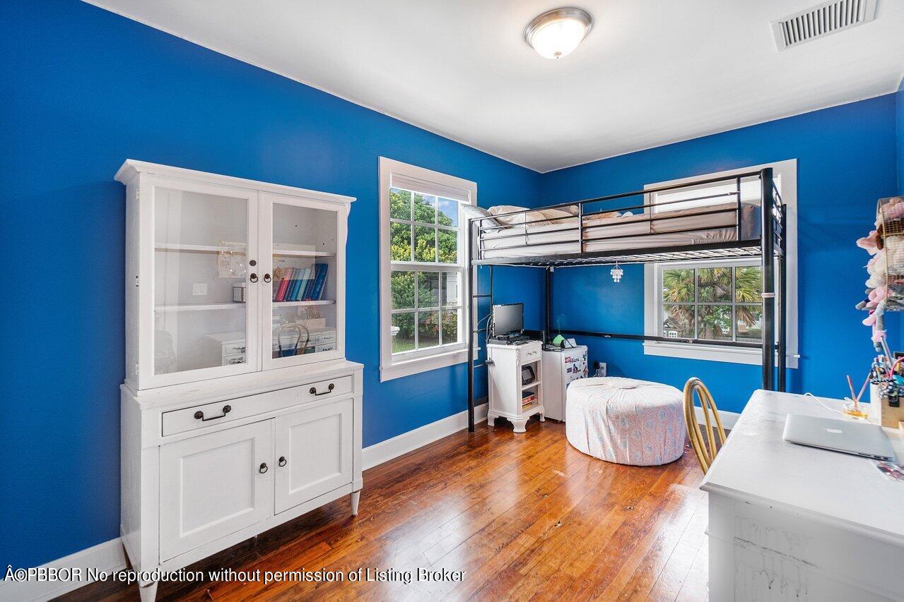 231 Argyle Road West Palm Beach, FL 33405 - Photo 14 of 17 a bedroom with furniture and a large window