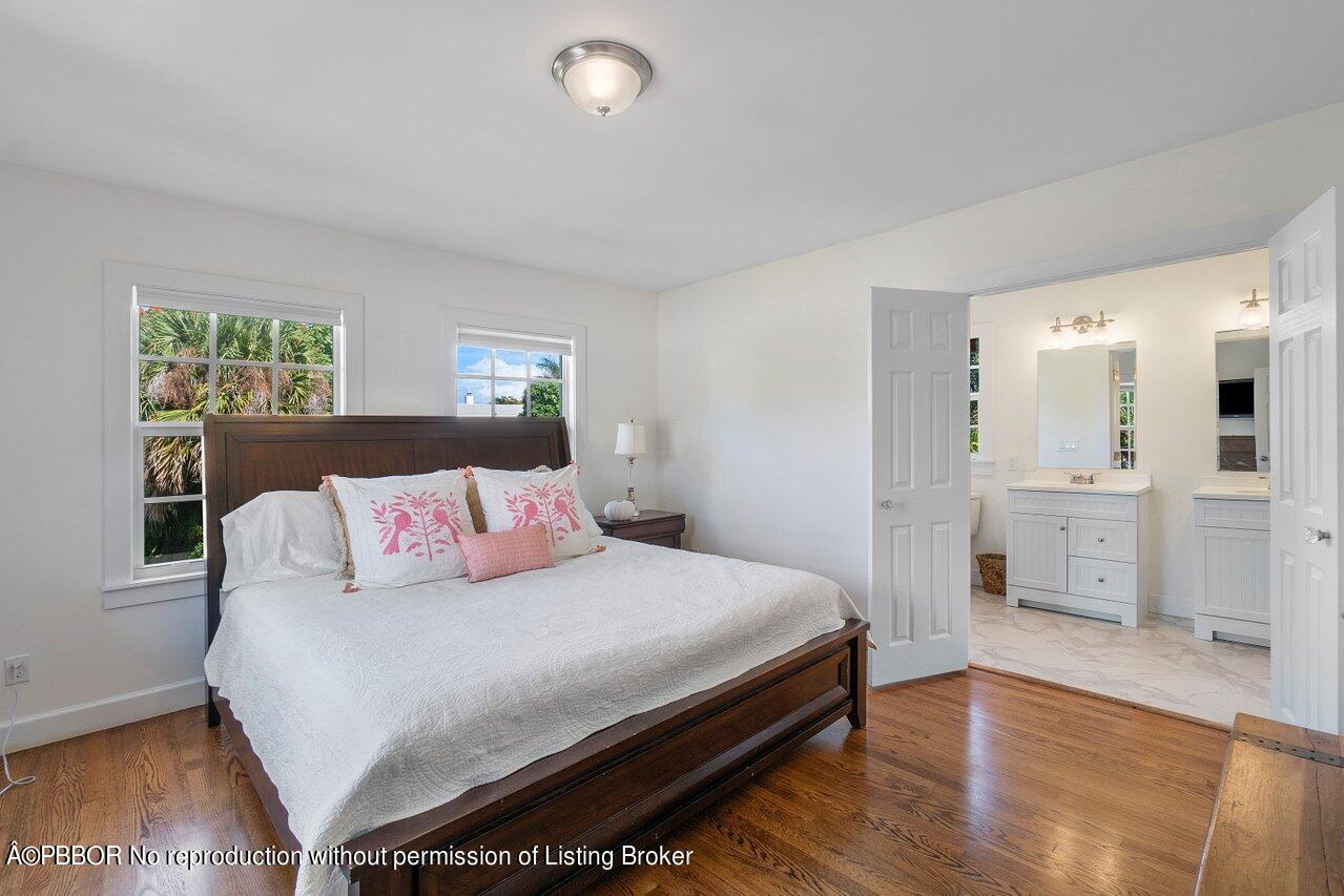 231 Argyle Road West Palm Beach, FL 33405 - Photo 15 of 17 a bedroom with a bed and a table