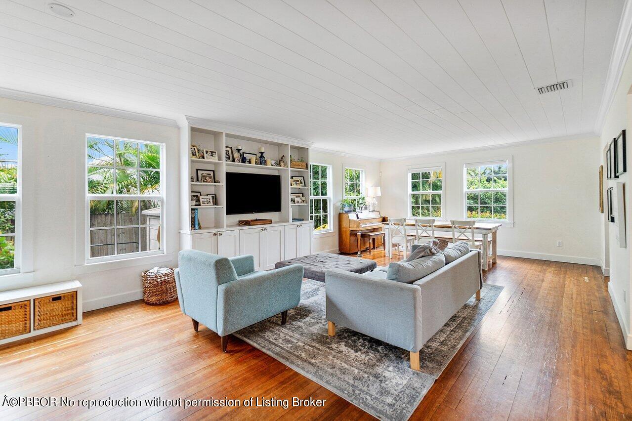 231 Argyle Road West Palm Beach, FL 33405 - Photo 2 of 17 a living room with furniture and a flat screen tv