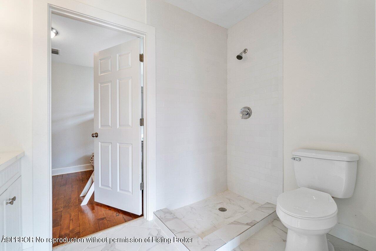 231 Argyle Road West Palm Beach, FL 33405 - Photo 10 of 17 a bathroom with a toilet and a shower