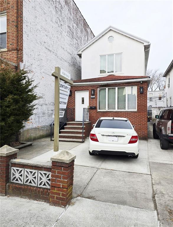 1730 East 4th Street Brooklyn, NY 11223 - Photo 1 of 24 a front view of a house with parking space