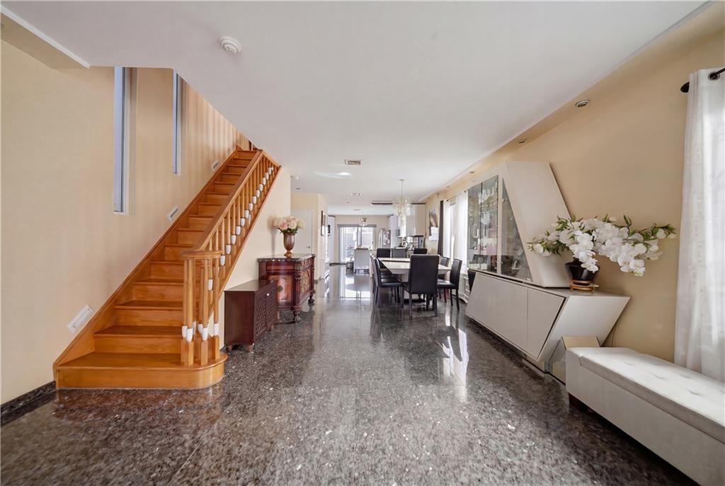 1730 East 4th Street Brooklyn, NY 11223 - Photo 11 of 24 a living room with furniture and stairs