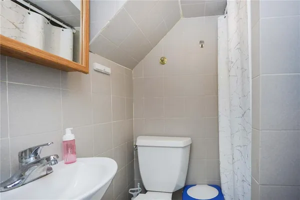 a view of a bathroom from the hallway
