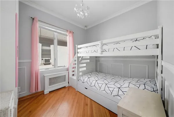 a bedroom with furniture and a window