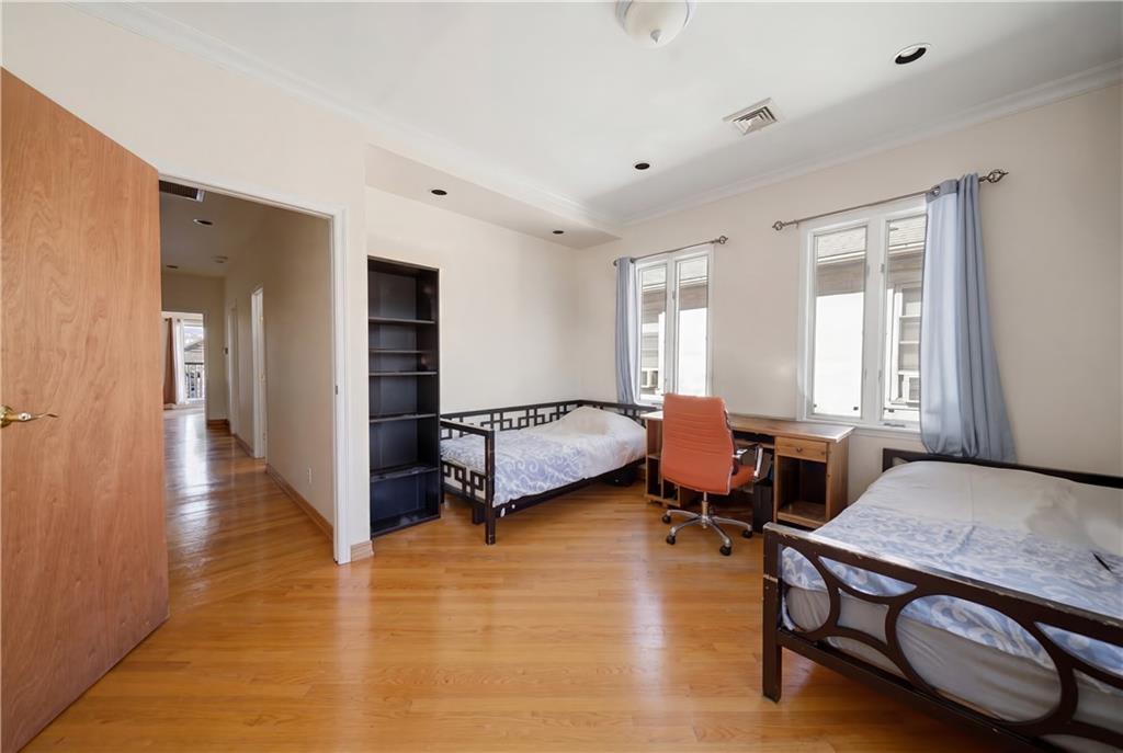 1730 East 4th Street Brooklyn, NY 11223 - Photo 20 of 24 a bedroom with furniture and a window