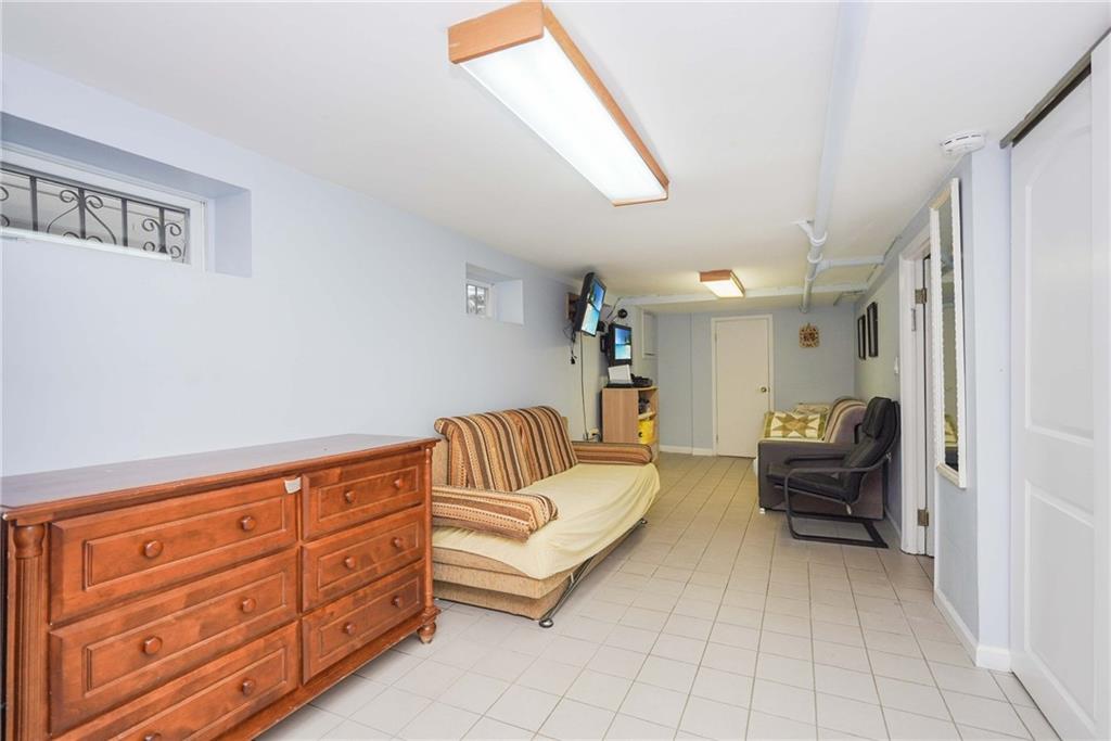 1730 East 4th Street Brooklyn, NY 11223 - Photo 21 of 24 a living room with furniture