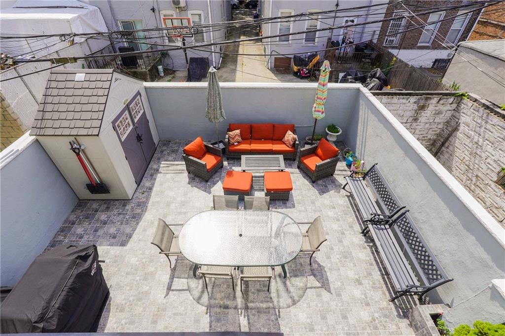1730 East 4th Street Brooklyn, NY 11223 - Photo 5 of 24 a balcony with table and chairs