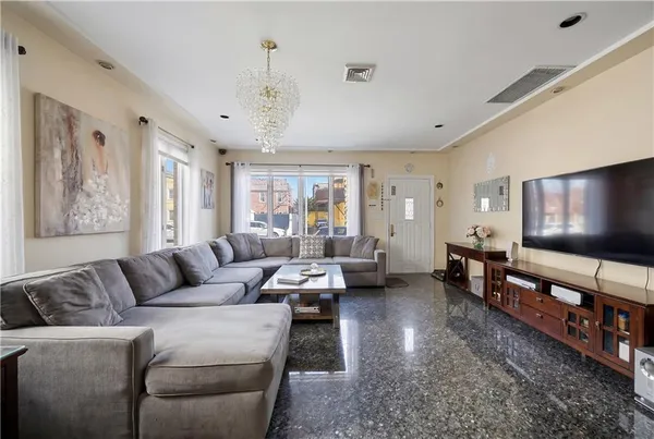 a living room with furniture and a large window