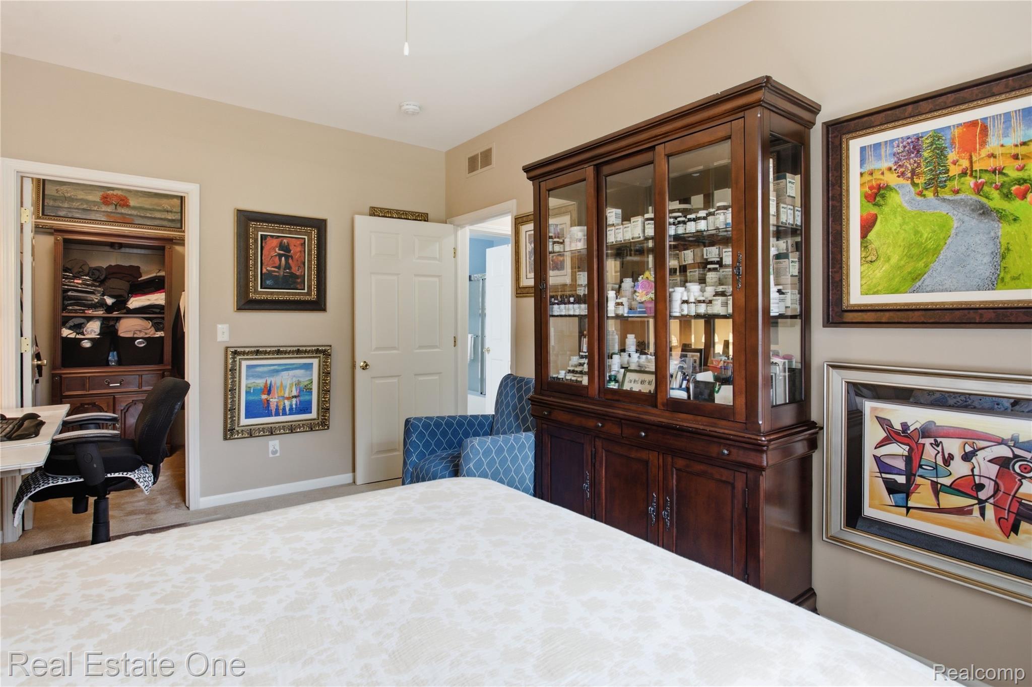 1828 Flagstone Circle, Unit 40 Rochester, MI 48307 - Photo 16 of 22 Recessed lighting illuminates the room with neutral-toned walls and carpet flooring
