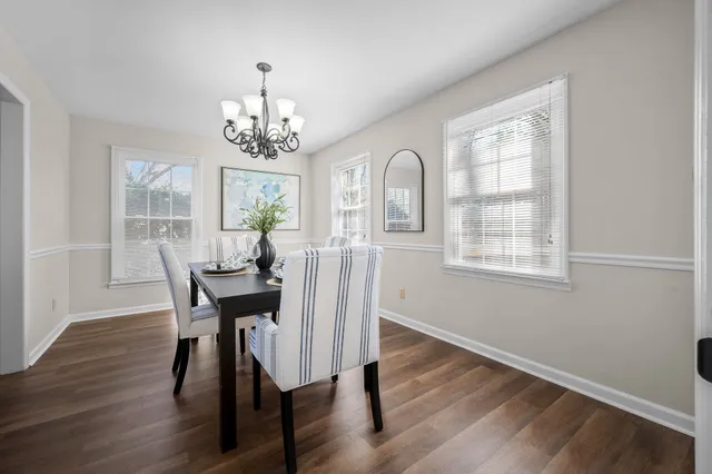 a bedroom with a bed lamp and a window