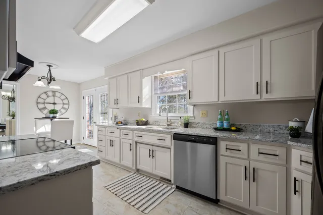 a front view of a house with yard and green space