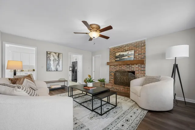 a living room with furniture and a window